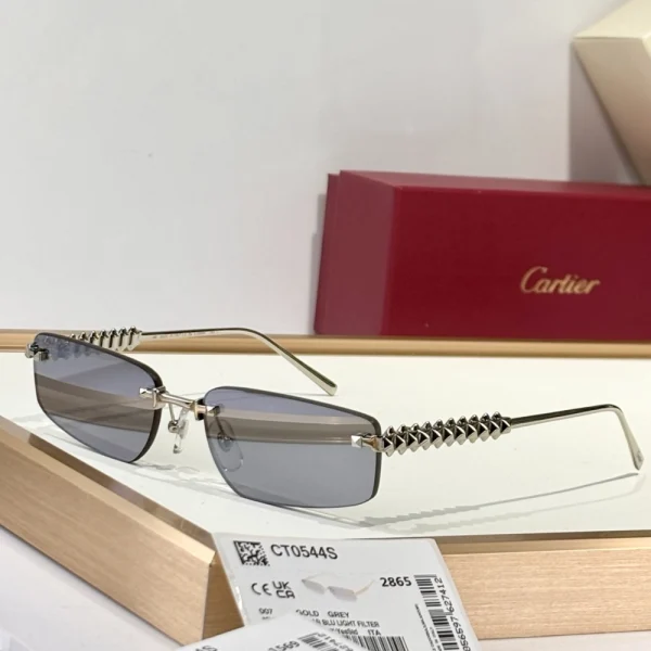 Close-up of Cartier Clash de Cartier sunglasses highlighting the distinctive clash motif along the hinge