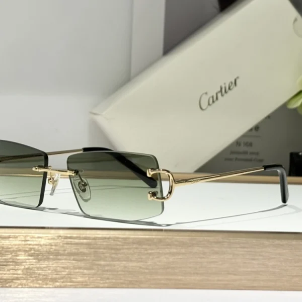 Elegant Cartier Décor C classique de Cartier sunglasses featuring iconic C motif and smooth lens gradient, placed beside Cartier box