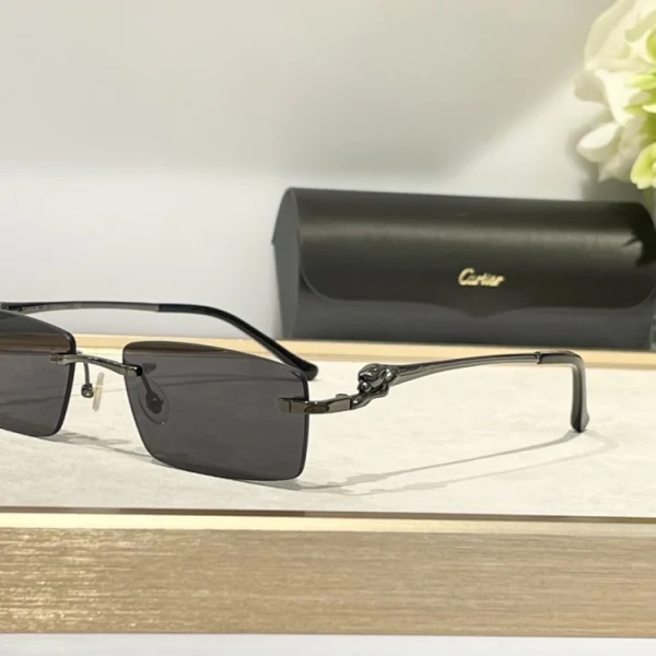 Cartier Panthère de Cartier sunglasses displayed flat beside original red Cartier box and branded lens cloth