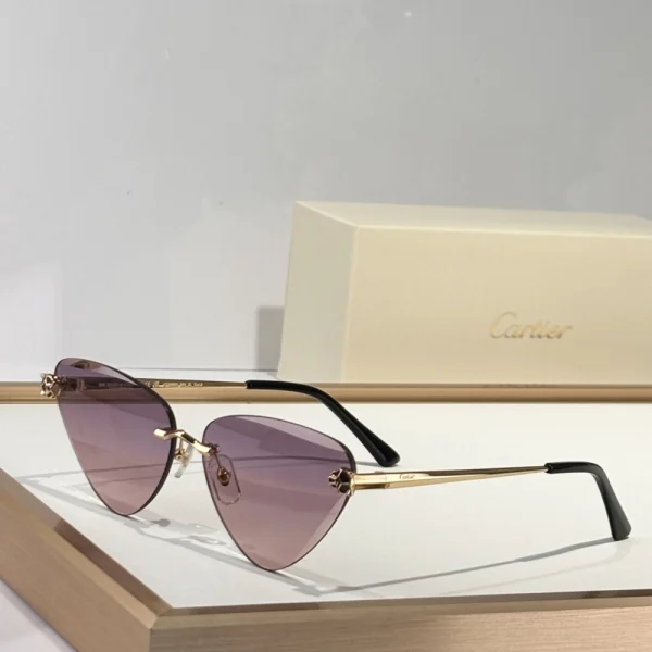 Luxury Cartier Panthère sunglasses with sculpted feline accents and dark gradient lenses