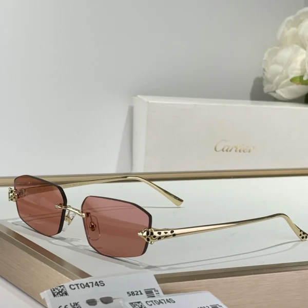 Close-up of the gold panther on Cartier Panthère de Cartier sunglasses hinge, emphasizing luxury craftsmanship and detail