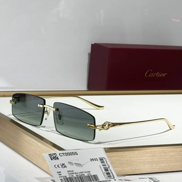 Cartier Panthère de Cartier sunglasses resting beside the signature red Cartier box, showcasing luxury and craftsmanship