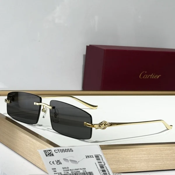 Cartier Panthère de Cartier sunglasses flat laid on a white textured background with matching branded pouch