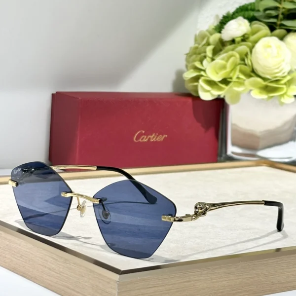 Luxury Cartier Panthère de Cartier sunglasses featuring sculpted feline detail and gradient lenses, styled with neutral tones