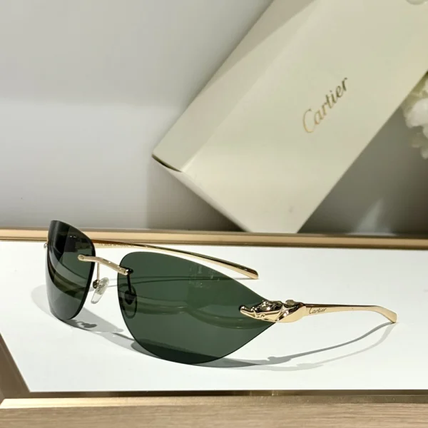 Elegant Cartier Panthère de Cartier sunglasses with polished acetate frame, placed on a neutral-toned fabric