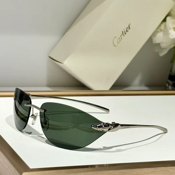 Cartier Panthère de Cartier sunglasses with bold panther detail and curved temples, captured in natural lighting