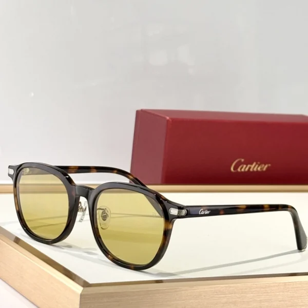 Elegant Première de Cartier sunglasses featuring soft geometric silhouette and gold-tone temples