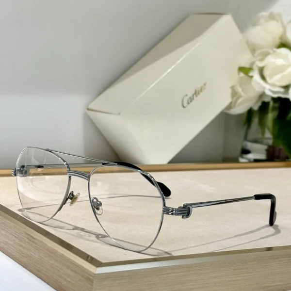 Cartier Première de Cartier sunglasses with gradient lenses, laid beside the signature red Cartier eyewear box