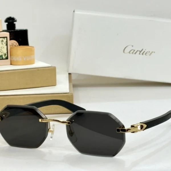 Elegant Cartier C Allongé de Cartier sunglasses resting on white marble, highlighting signature C motif at the hinge