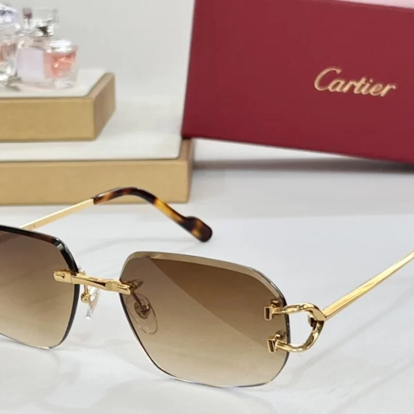 Elegant Cartier Classic C de Cartier sunglasses with polished frame and discreet C emblem, laid beside red Cartier box