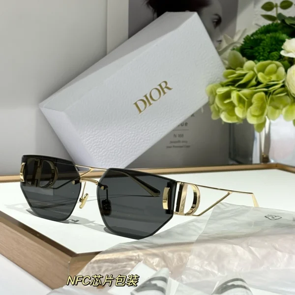 Christian Dior 30Montaigne B3U sunglasses with oversized square black frame and dark gradient lenses, styled on a white tabletop
