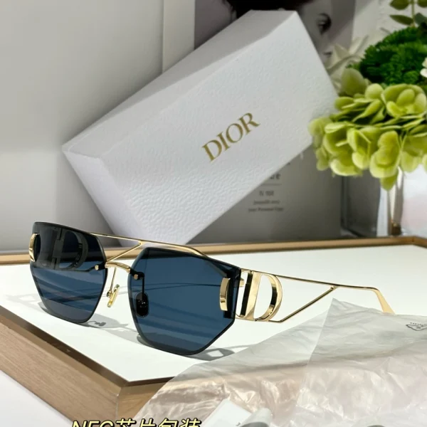 Elegant Christian Dior 30Montaigne B3U sunglasses resting on marble surface beside branded Dior case