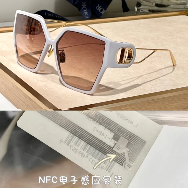 Close-up of Dior 30Montaigne BU sunglasses highlighting iconic gold CD logo on bold glossy temples