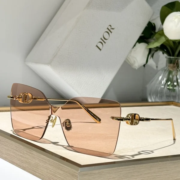 Christian Dior CD Chain M1U sunglasses with gold chain temple design, styled on clean white background for elegant display