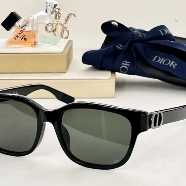 Flat lay of Christian Dior CD Icon S1F sunglasses beside original Dior eyewear box and authenticity booklet