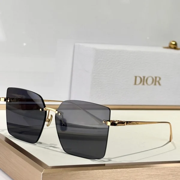 Christian Dior CDior S3U sunglasses with sleek aviator-style frame and tinted lenses, styled on a white tabletop