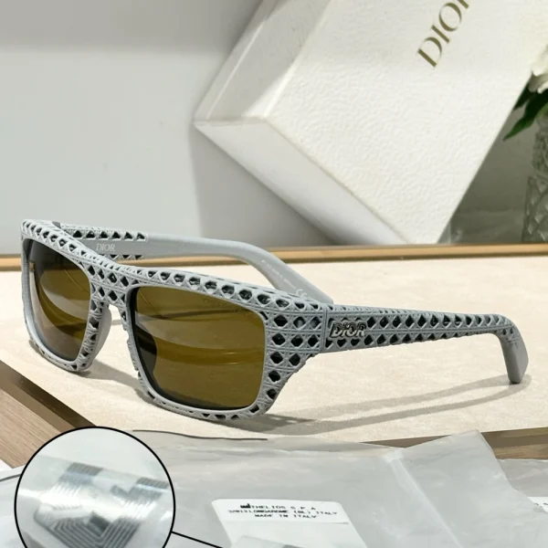 Elegant Christian Dior Dior3D S1I sunglasses resting beside branded Dior eyewear case and microfiber cloth