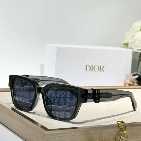 Christian Dior DiorOblique S1F sunglasses with bold square black frame and dark gradient lenses, styled on a white tabletop