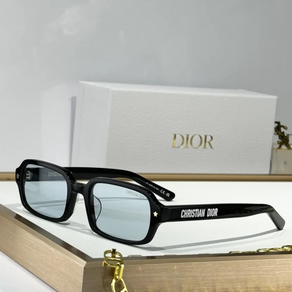 Christian Dior DiorPacific S3F sunglasses with bold rectangular black frame and dark gradient lenses, styled on a white tabletop