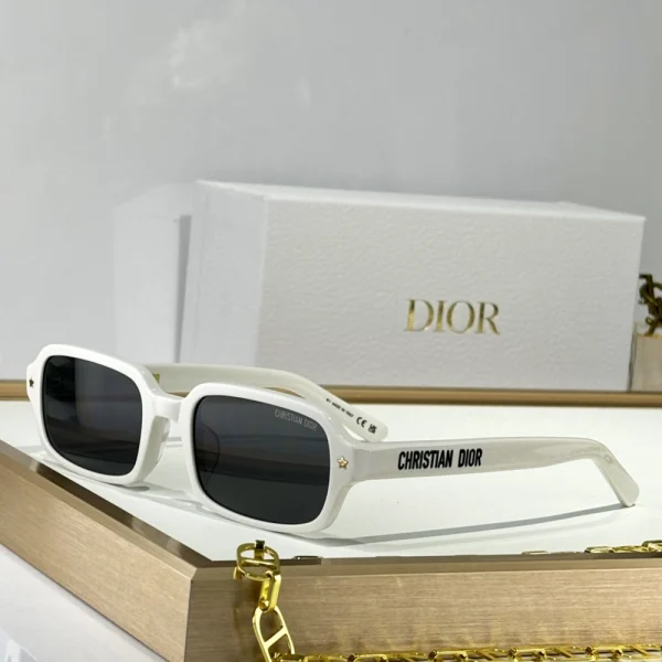Elegant Christian Dior DiorPacific S3F sunglasses resting beside branded Dior eyewear case and cleaning cloth
