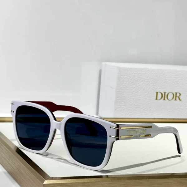 Christian Dior DiorSignature S7F sunglasses with oversized square black frame and gradient lenses, styled on a clean white tabletop