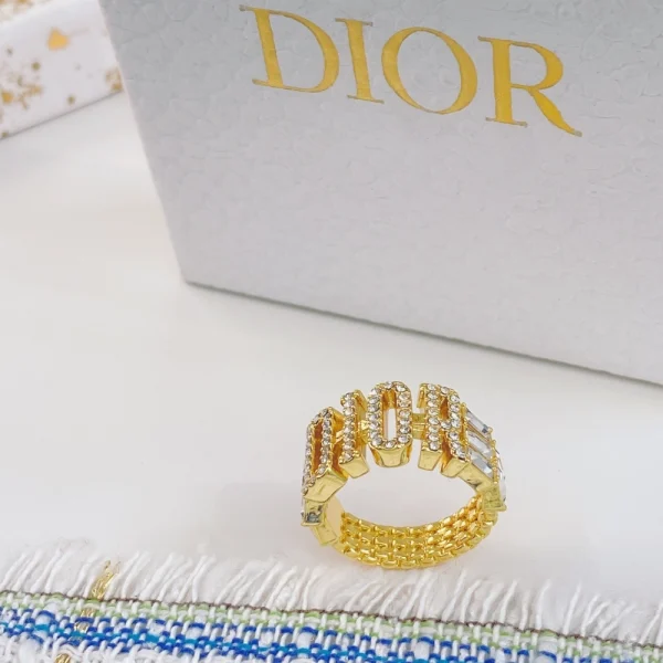Dior gold band ring with sleek minimalist design