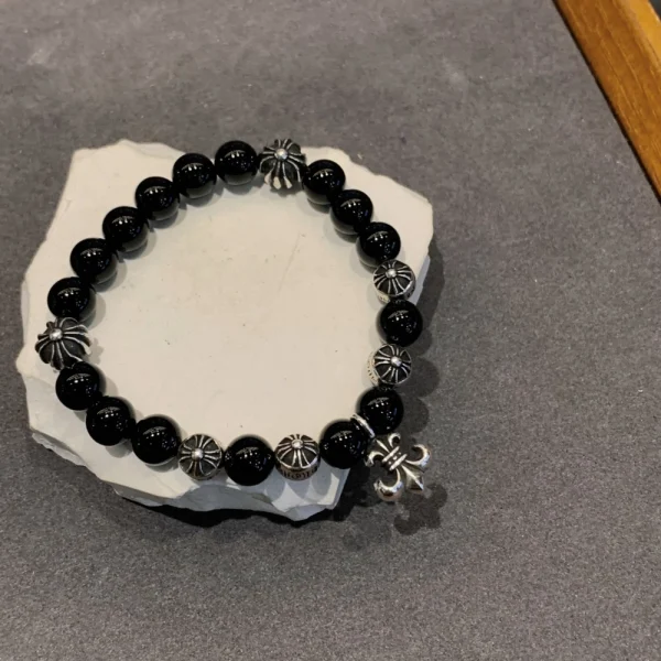 Handcrafted Chrome Hearts beaded bracelets with cross or fleur-de-lis accents for a luxury streetwear look.