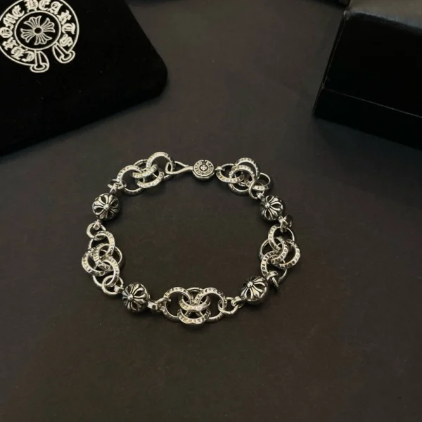 Chrome Hearts silver bracelet featuring cross ball links and signature gothic design in sterling silver.