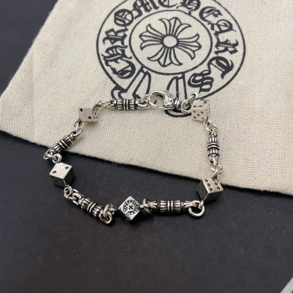 Sterling silver Chrome Hearts bracelet with engraved dice charms, handcrafted with edgy streetwear appeal.