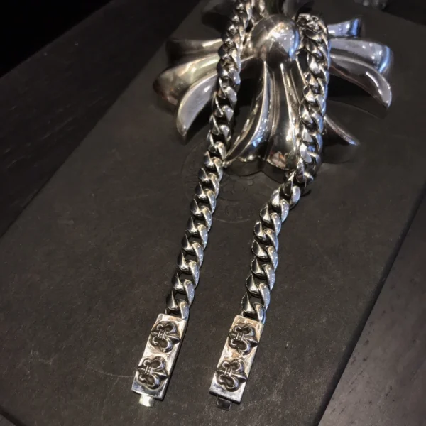 Sterling silver Chrome Hearts bracelet with double floral links, showcasing bold gothic craftsmanship and luxury style.