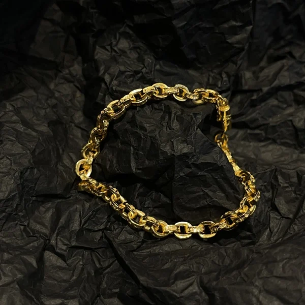 Chrome Hearts gold bracelet featuring iconic gothic motifs and luxurious handcrafted design.