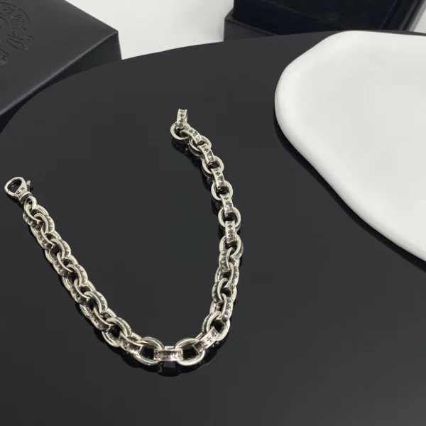 Bold Chrome Hearts paper bracelet combining edgy chain-link style with iconic silver craftsmanship.