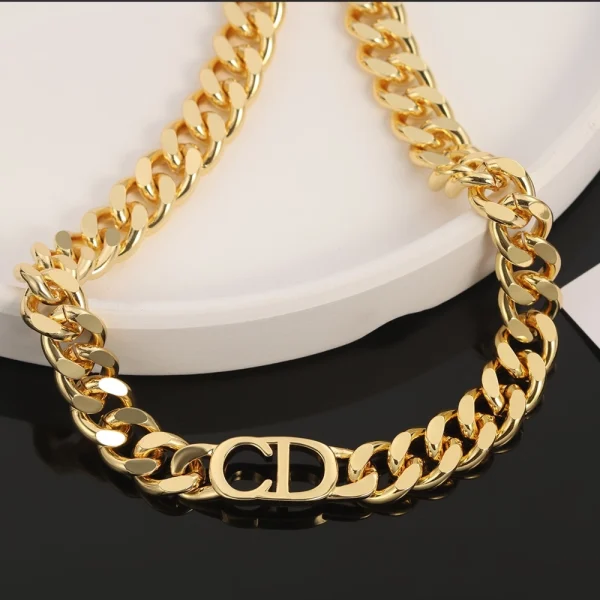 Close-up of Dior 30 Montaigne gold-finish metal bracelet showcasing fine details