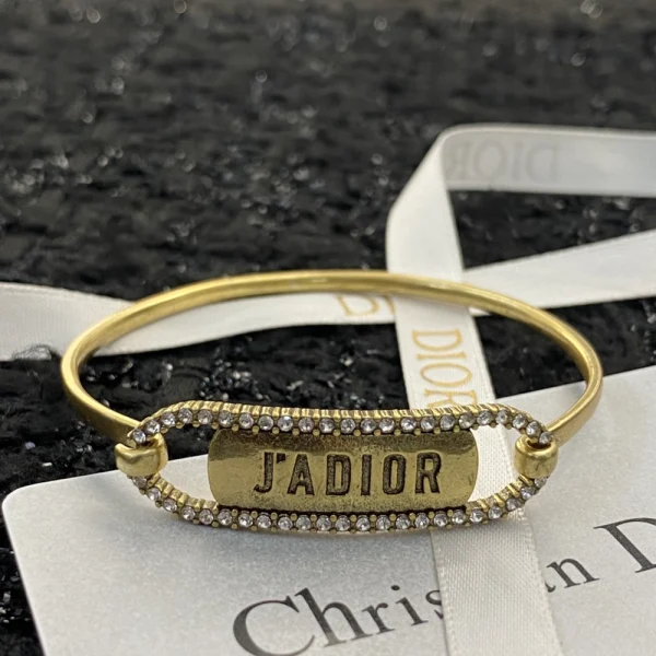 Dior J'ADIOR bangle bracelet in gold-tone metal with stone accents