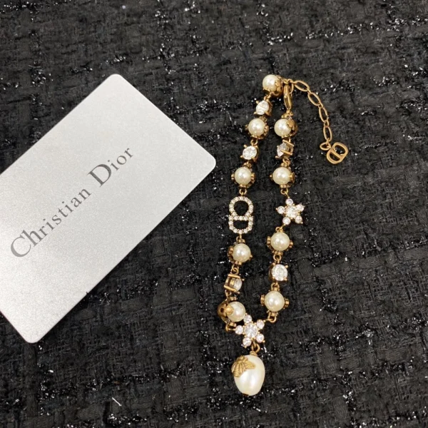 Elegant Dior bracelet for women with gold-tone finish and signature charm