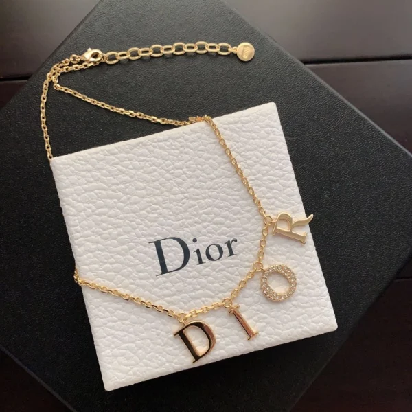 Dior Dio(r)evolution necklace featuring the iconic DIOR logo in gold-tone metal with crystal embellishments.
