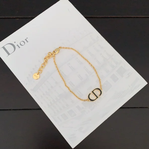 Dior gold logo CD bracelet with polished finish and elegant design