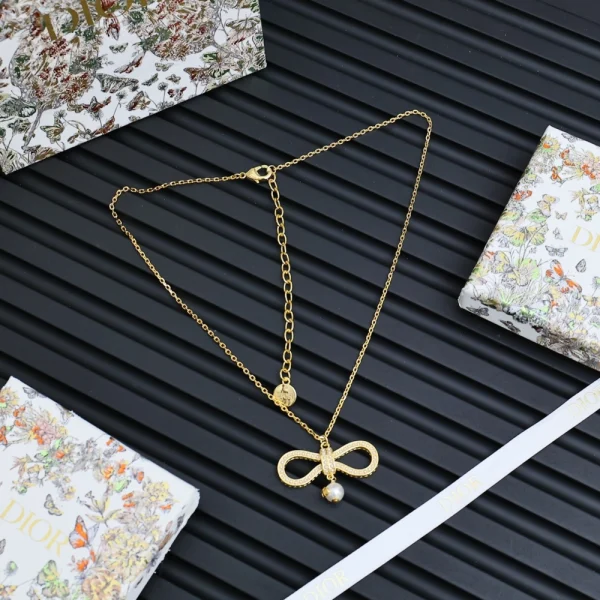 Dior Le Nœud de Dior necklace featuring a delicate bow design in white gold with pavé diamonds.
