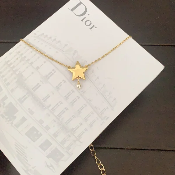 Luxury Dior necklace from the Petit CD Lucky Baroque line, showcasing baroque-inspired charms and signature CD logo.