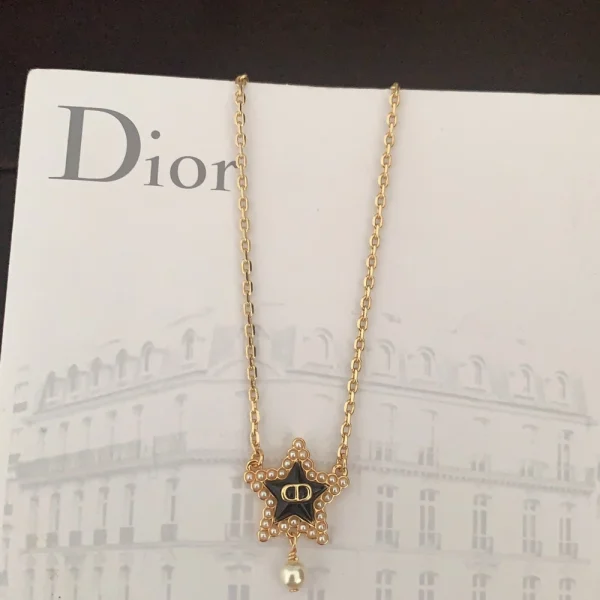 Dior Petit CD Lucky Baroque necklace featuring gold-finish metal and resin pearls with elegant vintage styling.