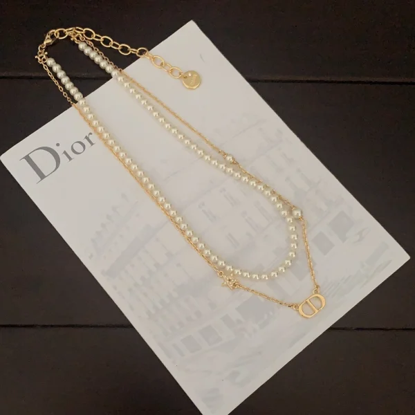 Minimalist Dior Petit necklace crafted in gold-finish metal, perfect for layering or solo styling.