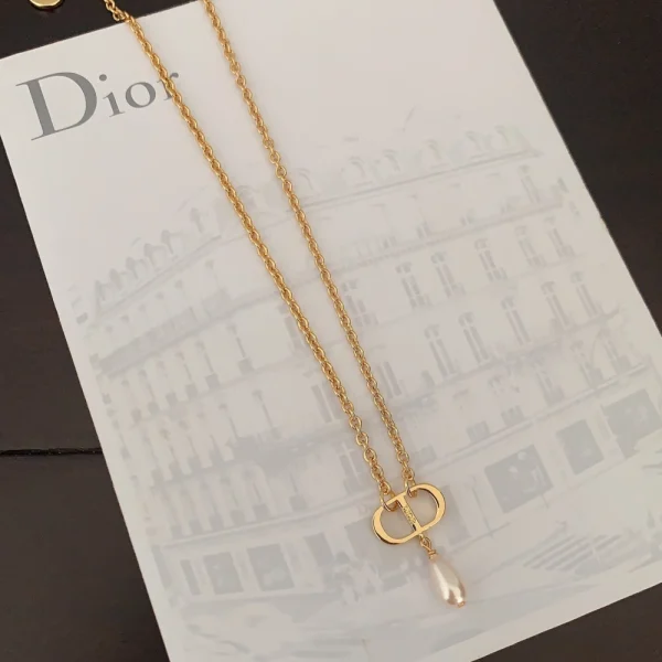 Dior Petit CD necklace in gold-finish metal featuring the iconic CD initials and elegant minimalist design.