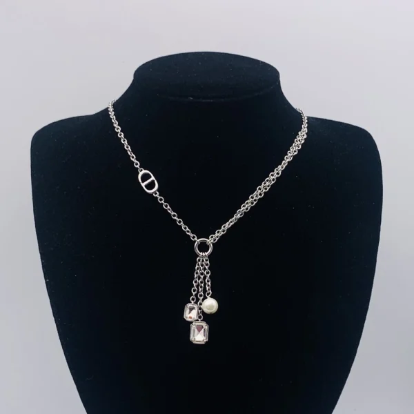 Dior Petit CD necklace in gold-tone metal featuring the iconic CD initials and refined modern design.
