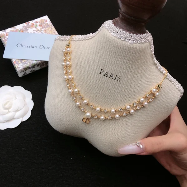 Luxury Dior necklace from the Petit CD Treasure line, combining minimalist styling with sparkling accents and timeless branding.