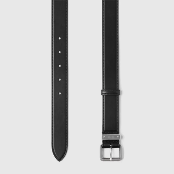 Detailed view of Gucci GG Emblem Black Leather Belt showcasing signature square buckle design