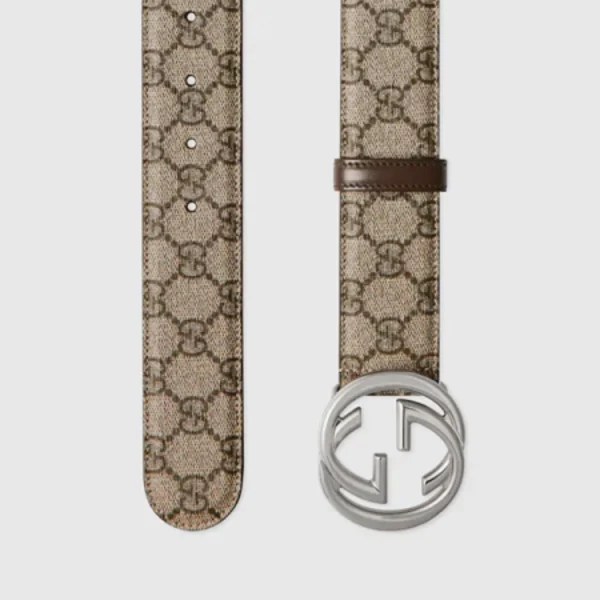 Close-up of Gucci belt showcasing polished Interlocking G buckle and premium leather texture