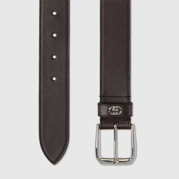Close-up of Gucci Belt in brown leather showcasing polished Interlocking G detail with refined craftsmanship