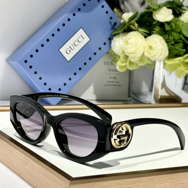 High-fashion Gucci cat-eye sunglasses with sculpted frame and gradient lenses