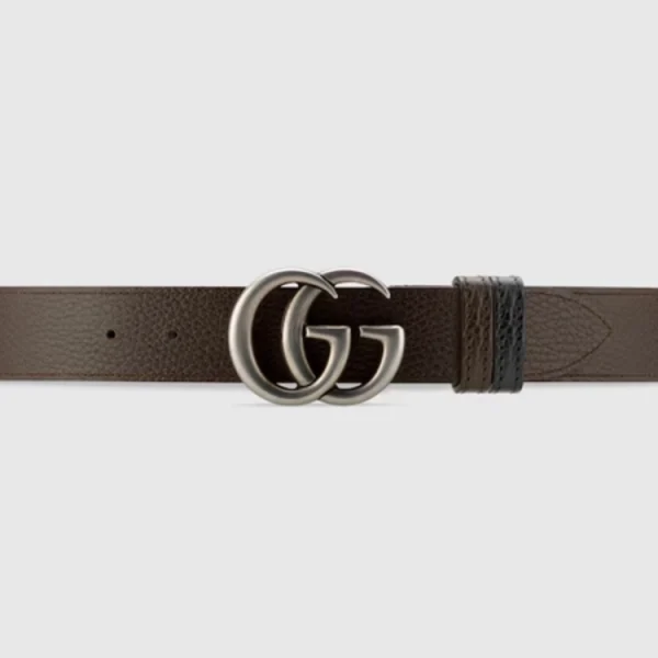Close-up of Gucci GG Marmont Reversible Leather Belt showcasing signature gold GG buckle detail