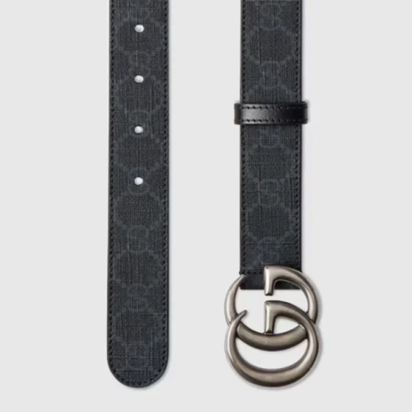 Close-up of Gucci GG Marmont Thin Black GG Supreme Belt featuring iconic gold GG buckle detail